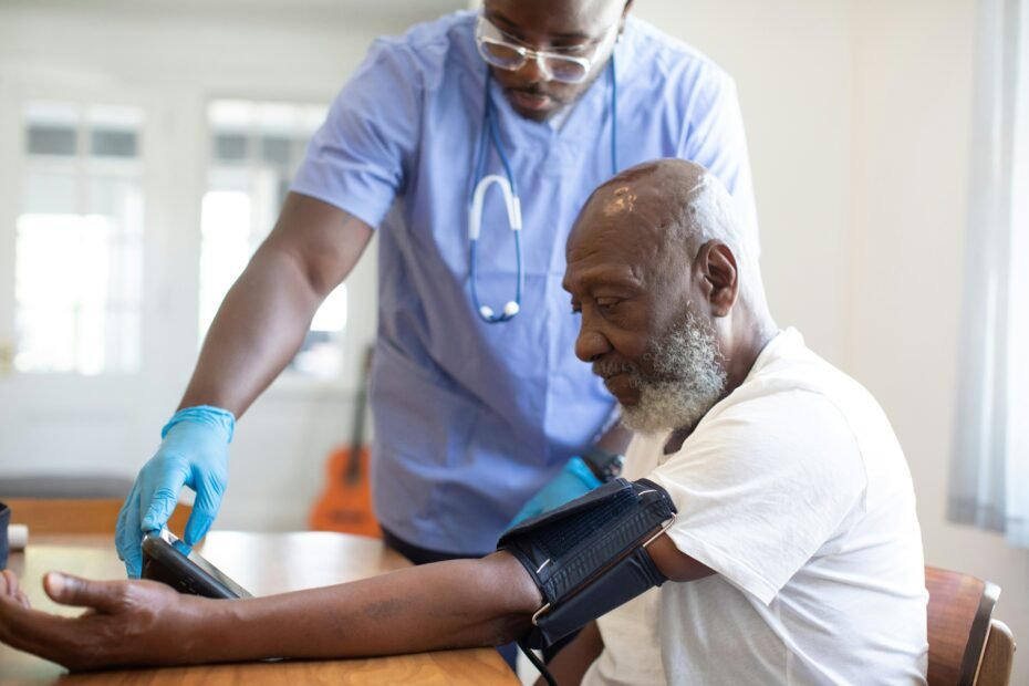 Doctor checking a patient's blood pressure during a routine health examination