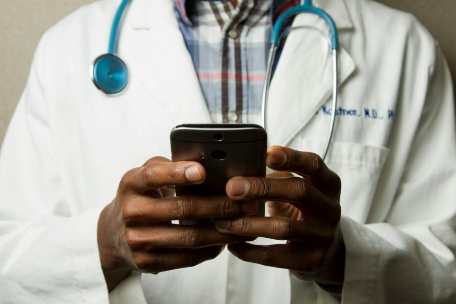 A doctor discussing preventive health screening results with an adult patient.